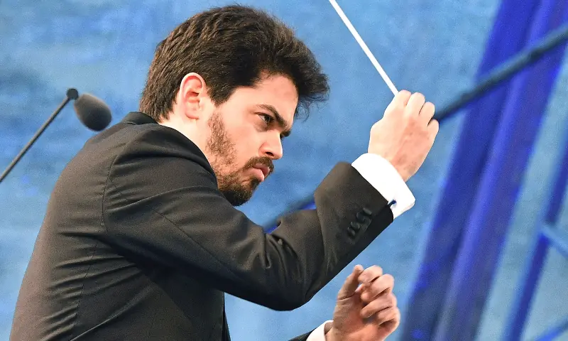  Israeli-born conductor Lahav Shani performs with the Vienna Symphony Orchestra, during the Festival of Joy concert, outside of the Hofburg Palace in Vienna, Austria, on May 8, 2018. &mdash; AFP 
