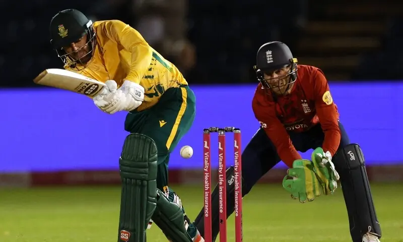 SOUTH AFRICAN batter Donovan Ferreira plays a shot as England wicket-keeper Jos Buttler reacts during the first T20 International at Sophia Gardens.&mdash;AFP