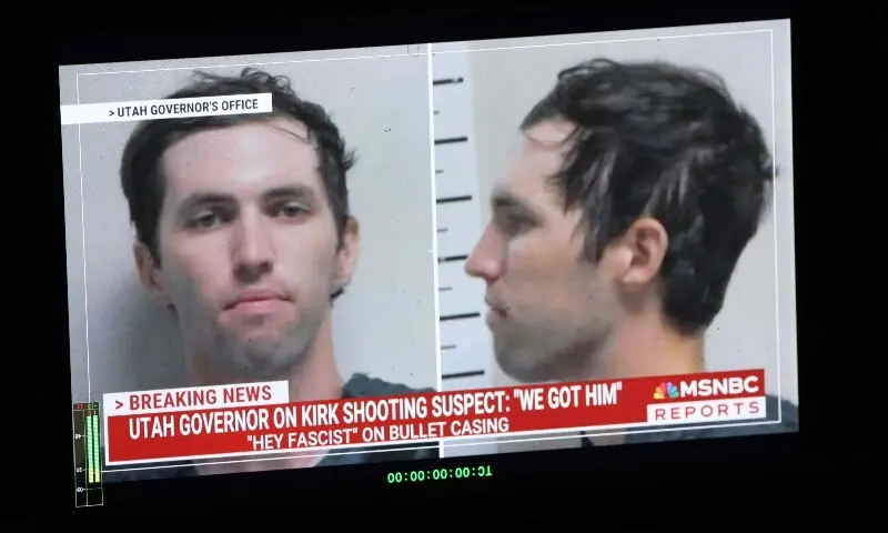 A TV monitor displays a picture of Tyler Robinson, the suspected of killing Charlie Kirk on Sept 11, in Orem, Utah, US, Sept 12. &mdash; AFP