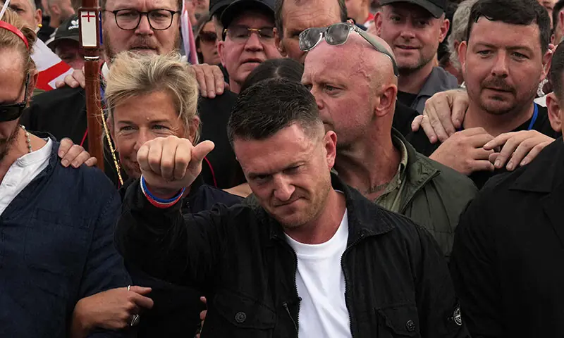 British far-right activist Tommy Robinson (C), whose real name is Stephen Yaxley-Lennon, gestures as he marches with supporters, including far-right commentator Katie Hopkins (CL back,) through central London during a ‘Free speech’ march, on September 13. — AFP