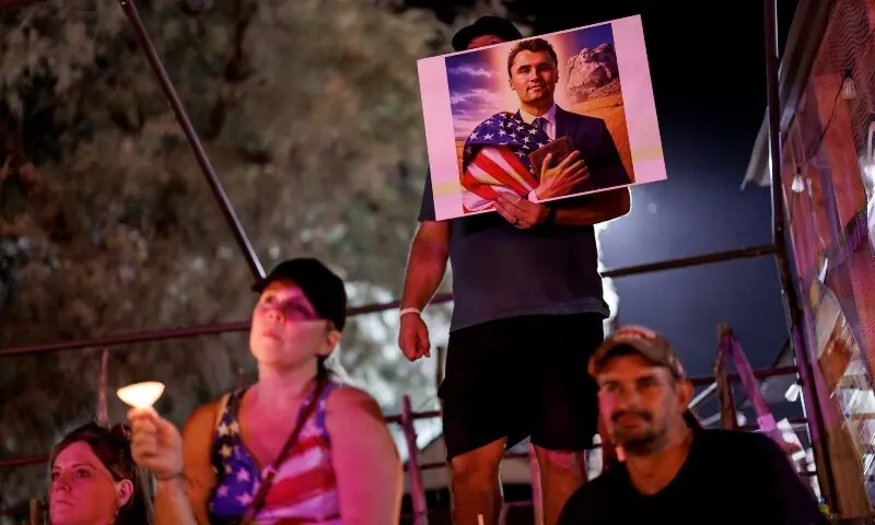 People attend a vigil for Charlie Kirk at Western Trails Ranch on September 13, 2025 in Morristown, Arizona. &mdash; AFP