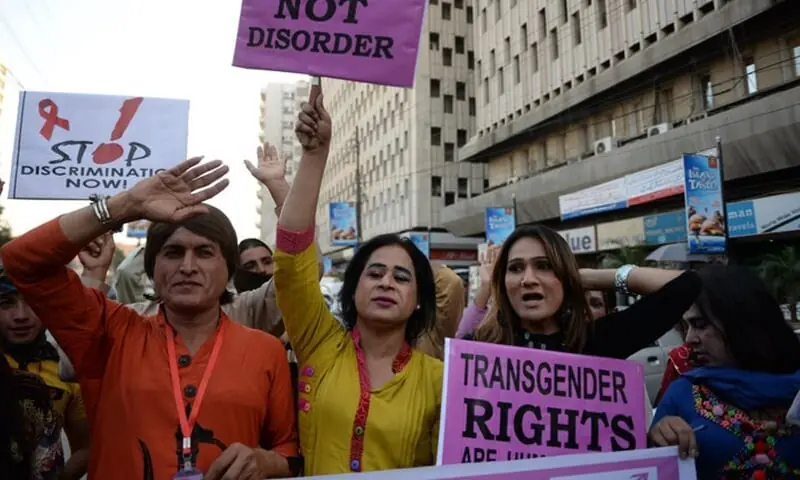 Image shows members of Pakistan&rsquo;s transgender community holding placards at a rally. &mdash; AFP/File