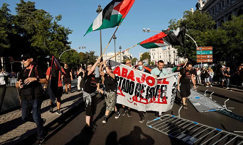 Pro-Palestinians protestors invade the street during the 21st and last stage of the Vuelta a Espana 2025 cycling race, in Madrid, Spain on September 14. — AFP