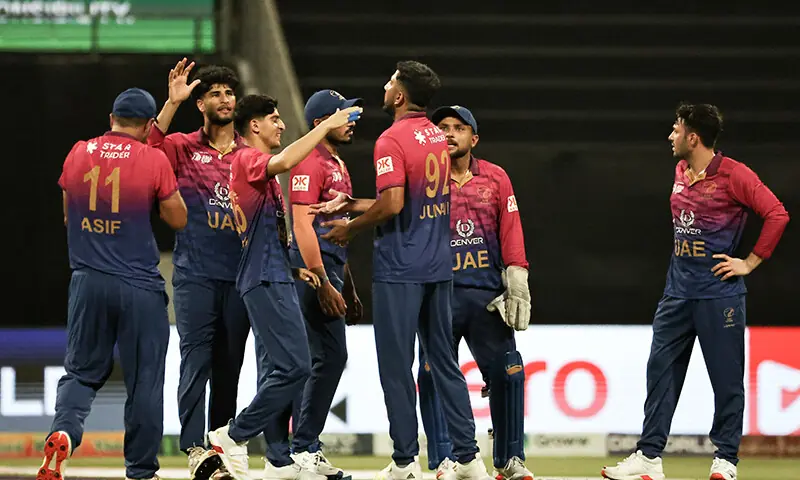 UAE&rsquo;s players celebrate after the dismissal of Oman&rsquo;s Hassnain Shah during the Asia Cup 2025 Twenty20 international cricket match between United Arab Emirates and Oman at the Sheikh Zayed Cricket Stadium in Abu Dhabi on September 15, 2025.  &mdash; AFP