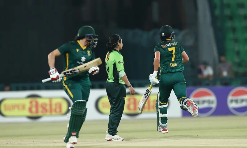 South African batters take a run Pakistan skipper Fatima Sana looks on at the first one-day international match of their series in Lahore on September 16. &mdash; X/PCB