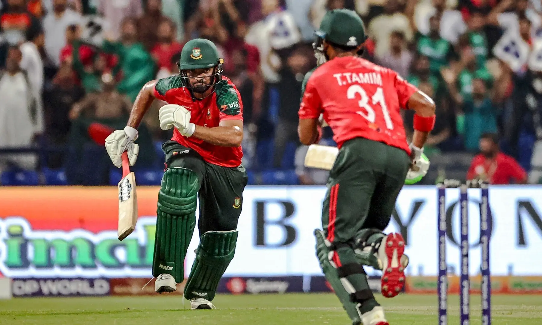BANGLADESH openers Saif Hassan (L) and Tanzid Hasan run between the wickets during the Asia Cup Twenty20 International against Afghanistan at the Sheikh Zayed Cricket Stadium on Tuesday.&mdash;AFP