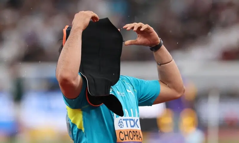 India&rsquo;s Neeraj Choppra looks dejected with his back brace on his head during the final. &mdash; Reuters