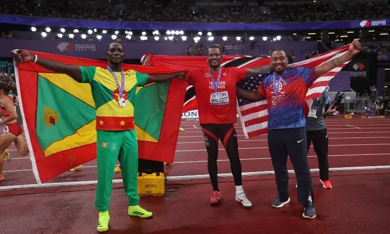 Gold medallist Trinidad and Tobago&rsquo;s Keshorn Walcott celebrates with his national flag after winning the Men&rsquo;s Javelin Throw Final alongside silver medallist Grenada&rsquo;s Anderson Peters and bronze medallist Curtis Thompson of the US. &mdash; Reuters