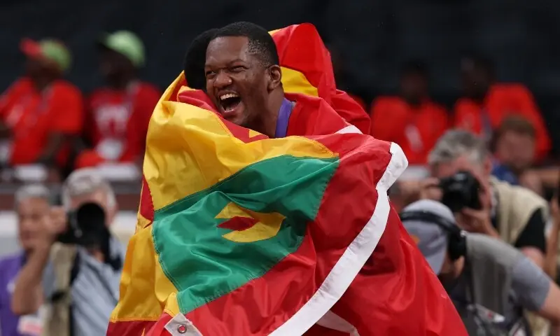 Gold medallist Trinidad and Tobago&rsquo;s Keshorn Walcott celebrates with his national flag after winning the Men&rsquo;s Javelin Throw Final with silver medallist Grenada&rsquo;s Anderson Peters. &mdash; Reuters