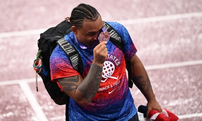 Bronze medallist Curtis Thompson of the US celebrates with his medal after the final. &mdash; Reuters