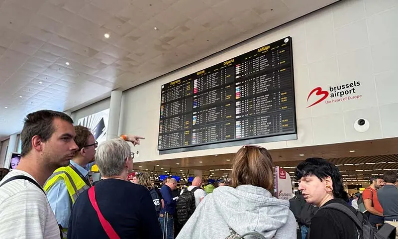 Travellers wait at Brussels airport, after a cyberattack at a service provider for check-in and boarding systems disrupted operations at several major European airports, in Zaventem near Brussels, Belgium on September 20. &mdash; Reuters