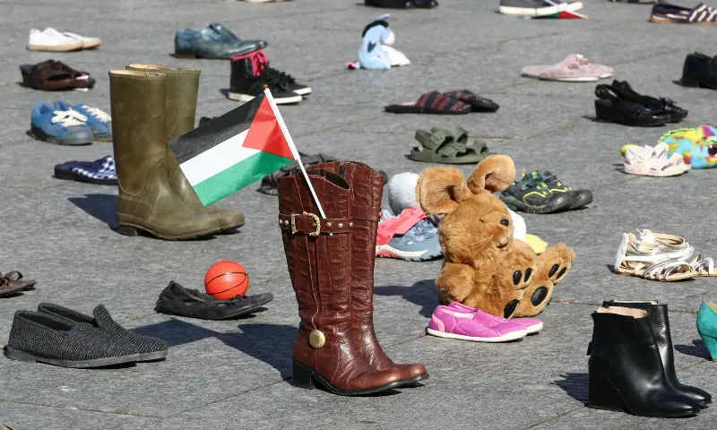  This photograph shows shoes and toys laid out on Place Kleber symbolising Palestinians killed during Israel&rsquo;s offensive on the Gaza strip, in Strasbourg, eastern France on Sept 20, 2025, as part of a symbolic action named &ldquo;Operation Shoes &ndash; Lives, not just numbers!&rdquo; by the Collectif Palestine 67. &mdash; AFP 