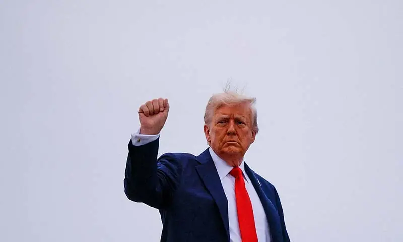 US President Donald Trump gestures with a raised fist as he boards Air Force One at Joint Base Andrews, Maryland, the US on September 21. — Reuters US President Donald Trump gestures with a raised fist as he boards Air Force One at Joint Base Andrews, Maryland, the US on September 21. — Reuters