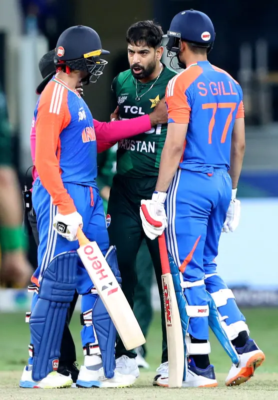    DUBAI: Pakistan pacer Haris Rauf (C) gets into a heated exchange with Indian openers Shubman Gill and Abhishek Sharma during their Super 4 encounter in the Asia Cup tournament.&mdash;Reuters   