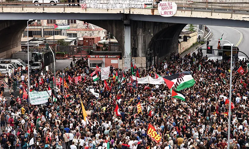 People gather for a demonstration, as dockworkers take part in a strike near the port of Genoa as part of a nationwide &lsquo;Let&rsquo;s Block Everything&rsquo; protest, with activists calling for a halt to arms shipments to Israel, in Genoa, Italy on September 22. &mdash; Reuters