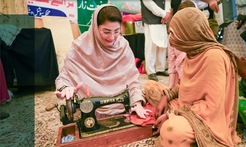 Punjab Chief Minister Maryam Nawaz uses a sewing machine while visiting Bahawalnagar to assess the flood situation on September 22, 2025. &mdash; pmln_org/X