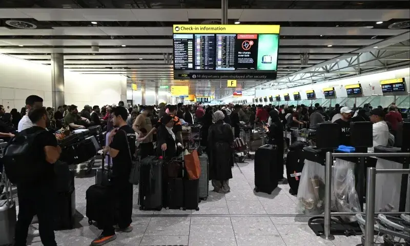 Travellers wait in terminal 4 at Heathrow Airport, west of London on September 20, 2025. Major European airports including Brussels, Berlin and London&rsquo;s Heathrow were Saturday hit by &ldquo;cyber-related disruption&rdquo; affecting check-in and baggage drop systems and causing delays, airport service provider Collins Aerospace said. &mdash; AFP/ Justin Tallis