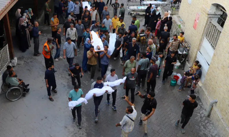 Mourners carry the bodies of Palestinians, who, according to medics, were killed in a deadly overnight Israeli strike on a building where displaced people were taking shelter, amid an Israeli military operation, at Al-Ahli Arab Hospital in Gaza City, on September 24. &mdash; Reuters