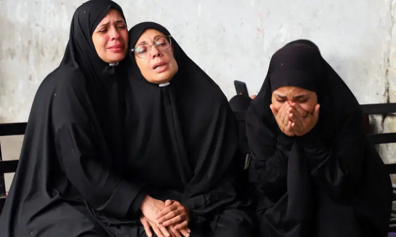 Mourners react during the funeral of Palestinians, who, according to medics, were killed in a deadly overnight Israeli strike on a building where displaced people were taking shelter, amid an Israeli military operation, at Al-Ahli Arab Hospital in Gaza City, on September 24. &mdash; Reuters