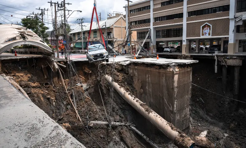 A vehicle is removed from the edge of a hole in the ground after a road collapsed near a hospital in Bangkok on September 24, 2025. — AFP A vehicle is removed from the edge of a hole in the ground after a road collapsed near a hospital in Bangkok on September 24, 2025. — AFP