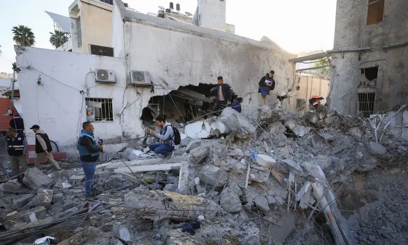Palestinians inspect a site where medics said two Israeli missiles hit a building inside the Al-Ahli Arab Baptist Hospital, shortly after patients were evacuated following a call from someone who identified himself with Israeli security, in Gaza City, on April 13. &mdash; Reuters/File