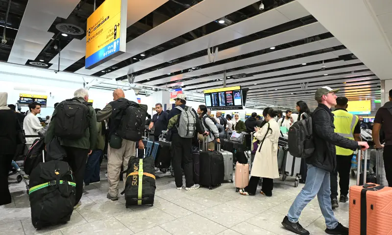 Travellers wait in the terminal at Heathrow Airport, west of London on September 20, 2025. &mdash; AFP