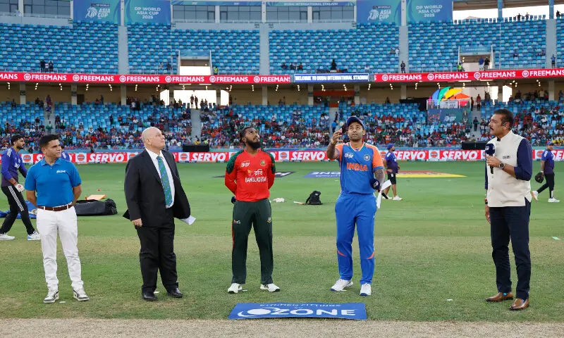 Jaker Ali of Bangladesh and Suryakumar Yadav, captain of India at toss during the Super Four match of the Asia Cup 2025 between India and Bangladesh at the Dubai International Stadium in Dubai, United Arab Emirates, on 24 September 2025. &mdash; ACC
