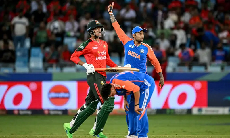 India&rsquo;s captain Suryakumar Yadav (back) gestures as teammate Kuldeep Yadav (front) reacts after a delivery during the Asia Cup 2025 Super Four Twenty20 international cricket match between Bangladesh and India at the Dubai International Stadium in Dubai on September 24, 2025. &mdash; AFP