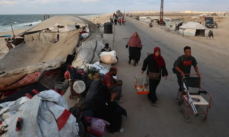 Displaced Palestinians move with their belongings southwards on a road in the Nuseirat refugee camp area in the central Gaza Strip on September 24. — AFP Displaced Palestinians move with their belongings southwards on a road in the Nuseirat refugee camp area in the central Gaza Strip on September 24. — AFP