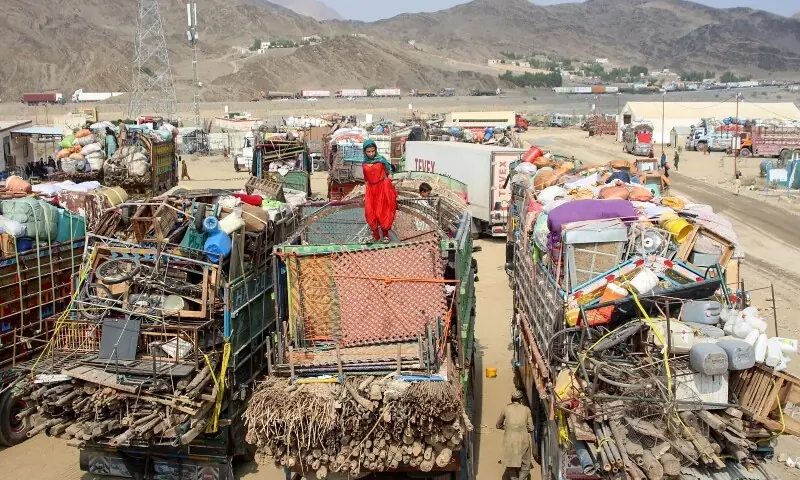 Deported Afghan refugees with their belongings from Pakistan, at a makeshift camp near the Torkham border on September 15 — AFP File Deported Afghan refugees with their belongings from Pakistan, at a makeshift camp near the Torkham border on September 15 — AFP File