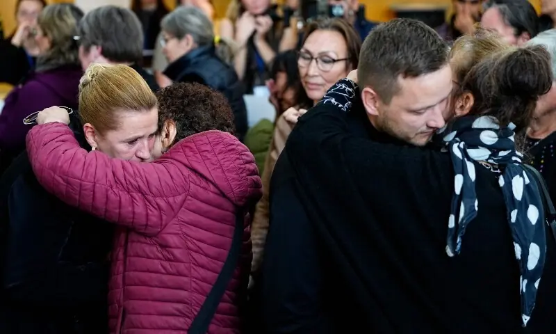 Greenland&rsquo;s head of government Jens-Frederik Nielsen and Denmark&rsquo;s Prime Minister Mette Frederiksen greet and apologie to the women after a meeting at the Katuaq cutural house, in Nuuk, Greeland, on September 24 &mdash; AFP
