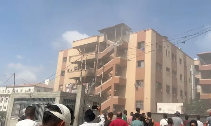 People walk at the site of Israeli strikes on Nasser hospital where Palestinian cameraman Hussam al-Masri, who was a contractor for Reuters, was killed along with other journalists and people, in Khan Younis in the southern Gaza Strip in this still image taken from video, on August 25. &mdash; Reuters/File Photo