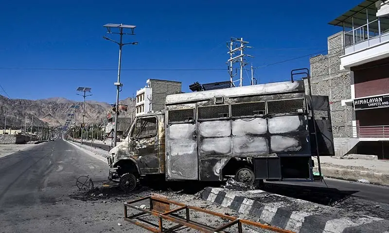 A burnt security vehicle is pictured near the Bharatiya Janata Party (BJP) office in Leh, occupied Kashmir on September 25. &mdash; AFP