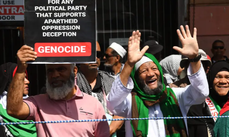 Protesters hold placards during civil society and faith-based organisations&rsquo; mass rally for Gaza, in Cape Town on September 27, 2025. &mdash; AFP