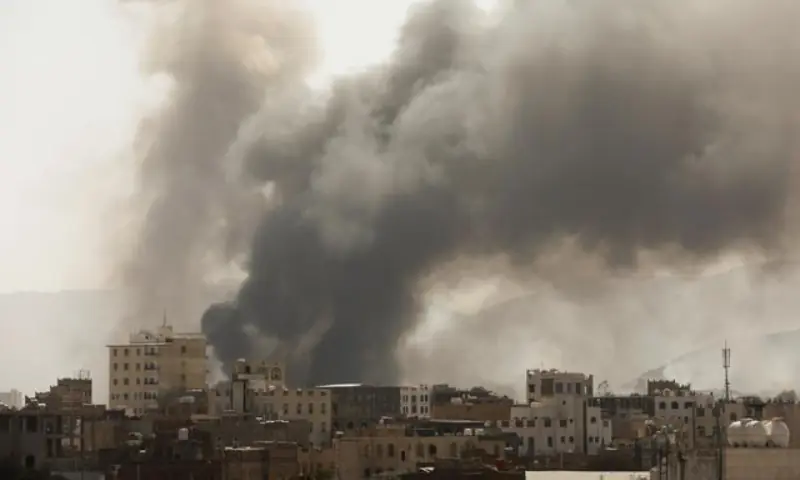 Smoke billows from the site of Saudi-led air strikes in Sanaa, Yemen, March 7, 2021. &mdash; Reuters