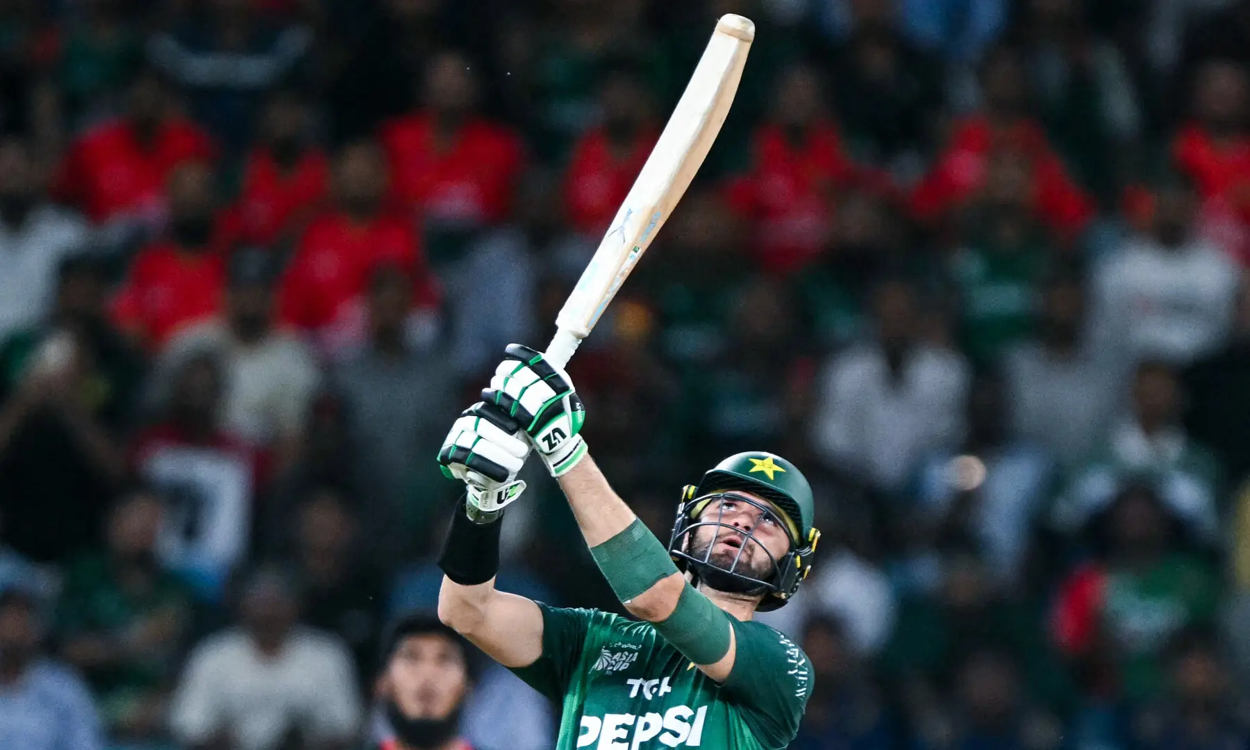Shaheen Shah Afridi plays a shot during the Asia Cup 2025 Super Four Twenty20 international cricket match between Bangladesh and Pakistan at the Dubai International Stadium, in Dubai on September 25, 2025. — AFP