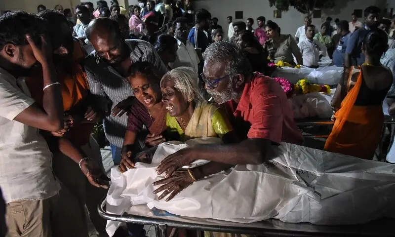 Relatives mourn after receiving the dead body of a victim who was killed in a stampede that broke out during a campaign rally last evening in the Karur district, in the Indian state of Tamil Nadu, on September 28. &mdash; AFP