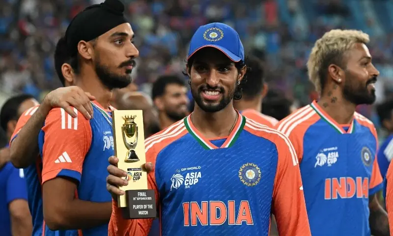 India&rsquo;s Tilak Varma holds up his man of the match trophy during the presentation ceremony at the end of the Asia Cup 2025 Twenty20 international cricket final match between India and Pakistan at the Dubai International Stadium in Dubai on September 28. &mdash; AFP