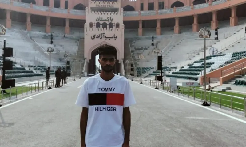 A picture of Raqib Bilal, who was released and repatriated by India today, stands at the Attari-Wagah border crossing on September 29. &mdash; X/@PakinIndia