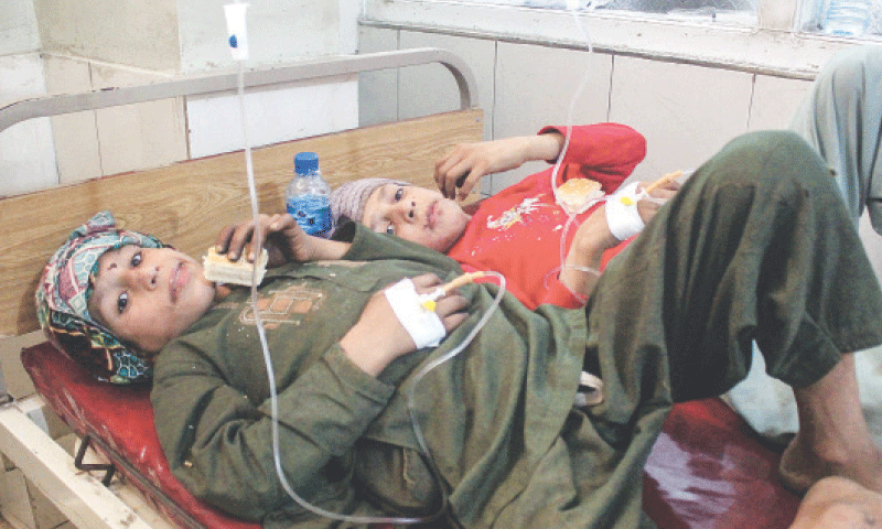 Injured Afghan children receive treatment at a hospital after an earthquake in Jalalabad.&mdash;AFP