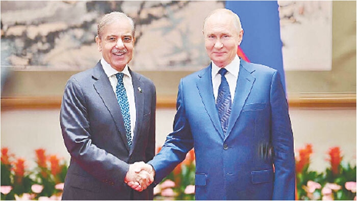 BEIJING: PM Shehbaz Sharif shakes hands with Russian President Vladimir Putin.—APP