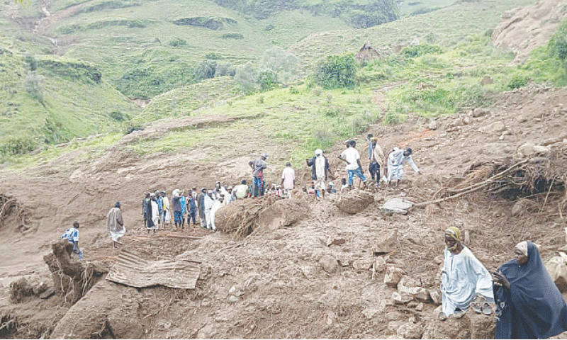 PEOPLE inspect the debris after a landslide devastated the village of Tarasin, in Sudan&rsquo;s Jebel Marra area.&mdash;AFP