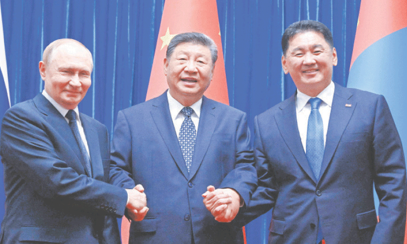 (FROM left) Vladimir Putin, Xi Jinping and Ukhnaagiin Khurelsukh, the presidents of Russia, China, and Mongolia, respectively, pose for a photo during a meeting in Beijing.&mdash;AFP