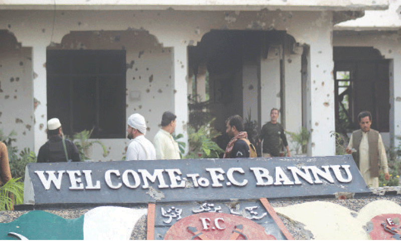 BANNU: Paramilitary soldiers survey the damage caused after terrorists attacked the Federal Constabulary headquarters.&mdash;Reuters