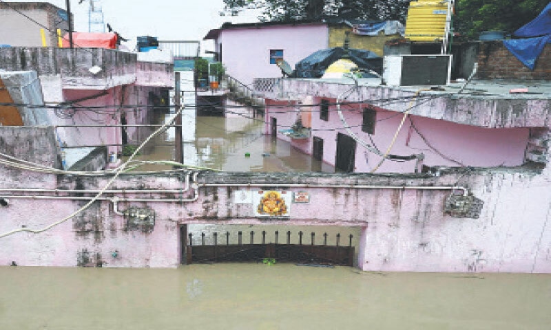 NEW DELHI: Inundated homes are pictured near the banks of the overflowing Yamuna, due to monsoon rains in India&rsquo;s north.&mdash;AFP