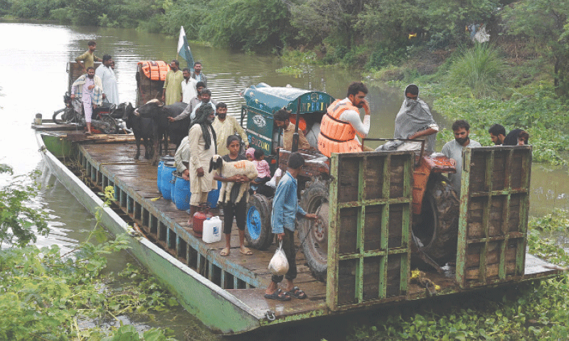 NAROWAL: Stranded farmers, their livestock and tractors are brought to safety on a raft (locally known as Baira). Pakistan Business Forum has urged the government to evolve a new flood strategy.&mdash;M. Arif/White Star