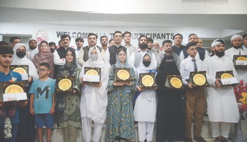 The position holders with provincial minister for education Faisal Khan Tarakai during a ceremony in Peshawar on Thursday. &mdash; White Star