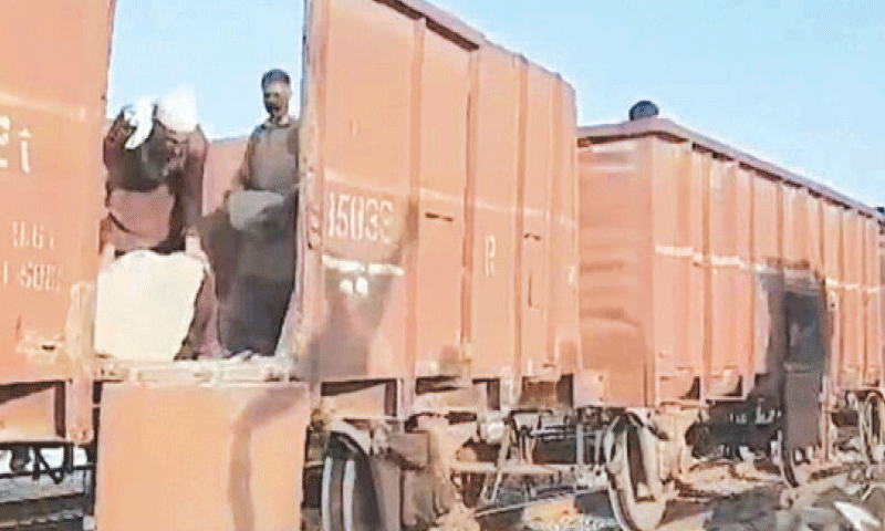 BAHAWALPUR: Stone being unloaded from train to strengthen Empress bridge protection. &mdash; Dawn