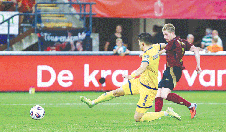 BRUSSELS: Kevin De Bruyne (R) of Belgium scores during the 2026 World Cup qualifier against Kazakhstan at Lotto Park.&mdash;Reuters