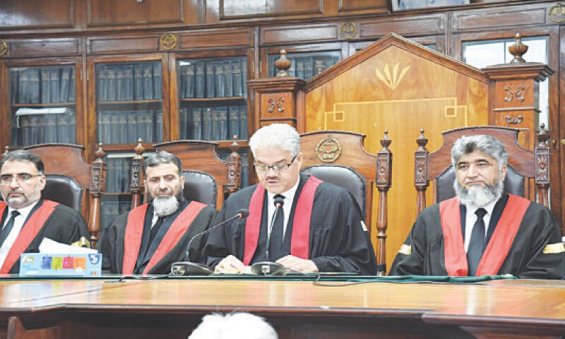 PHC Chief Justice S M Attique Shah addresses a ceremony in Peshawar on Monday. &mdash; Dawn